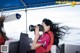 A woman taking a picture of herself on a boat.